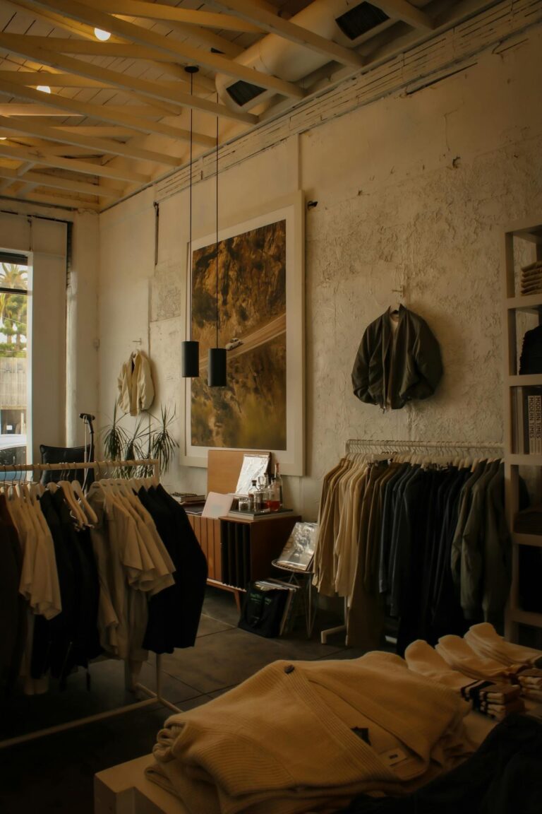 Cozy boutique interior featuring vintage clothing racks and artistic decorations for a unique shopping experience.